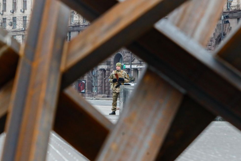A Ukrainian soldier standing guard in Kyiv