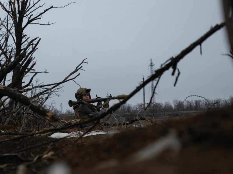A Ukrainian solider prepares to fire an RPG at enemy lines.