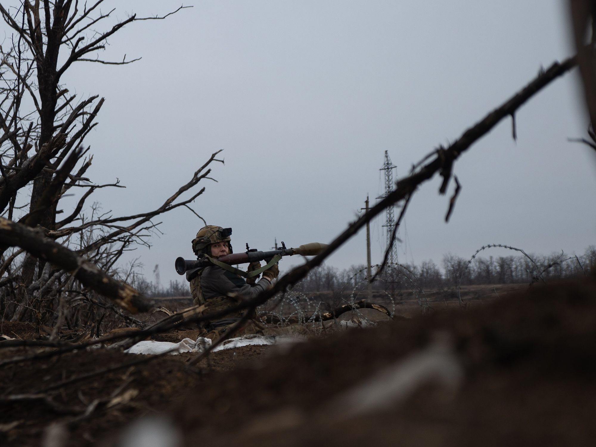 A Ukrainian solider prepares to fire an RPG at enemy lines.