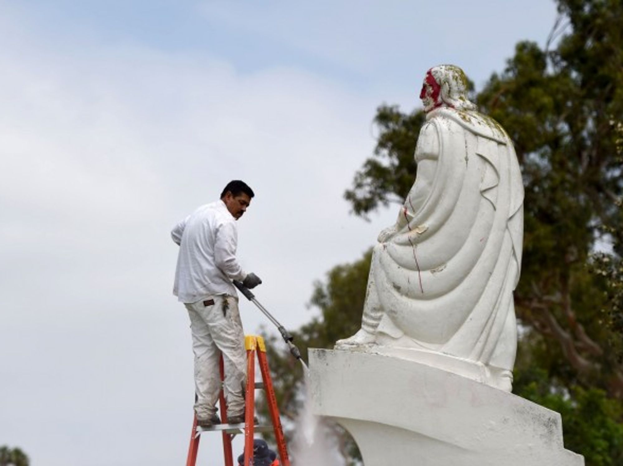 A vandalized Juan Rodriguez Cabrillo statue in San Pedro, California, is cleaned