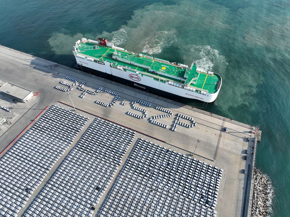 A vehicle carrier vessel docked at a Chinese port.