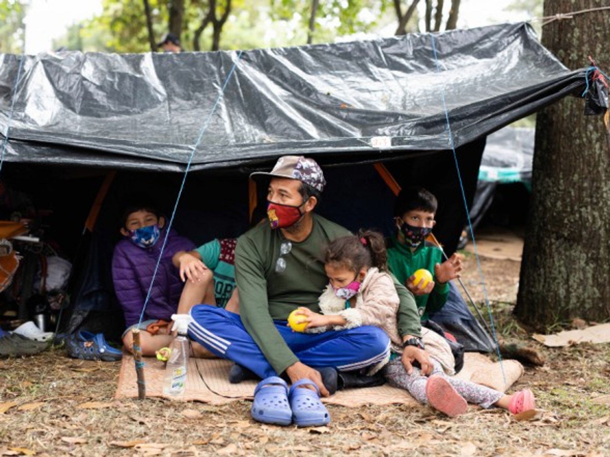 A Venezuelan family in a makeshift migrant camp in Bogota, Colombia