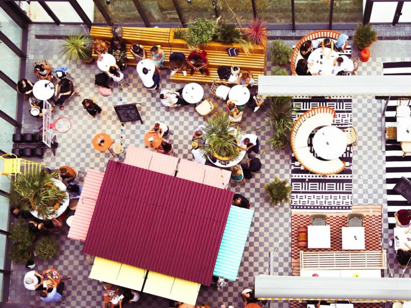 A view of brightly colored tables and ​chairs at Mama Shelter Paris West.