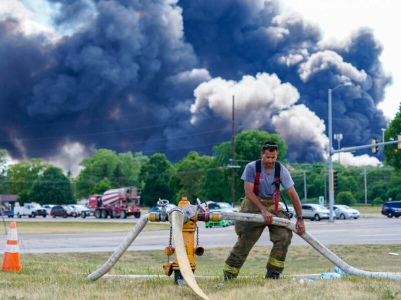 A volunteer firefighter helps put out the massive fire that broke out yesterday at a chemical plant in Rockton, Illinois. Residents within a one-mile radius of the site have been evacuated, as authorities warn that the blaze could last for days.