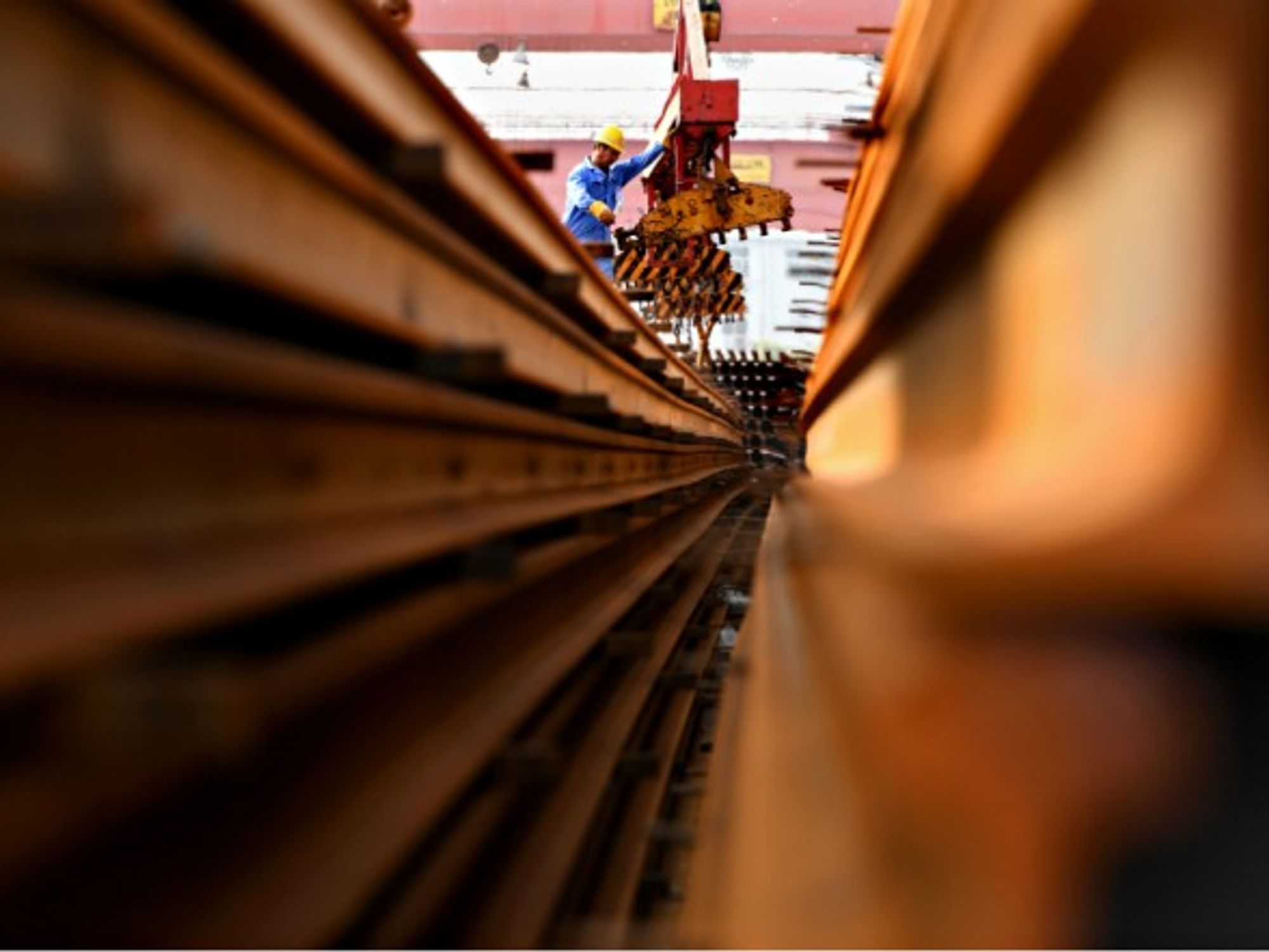 A welder prepares steel rails in Zhengzhou in 2017.