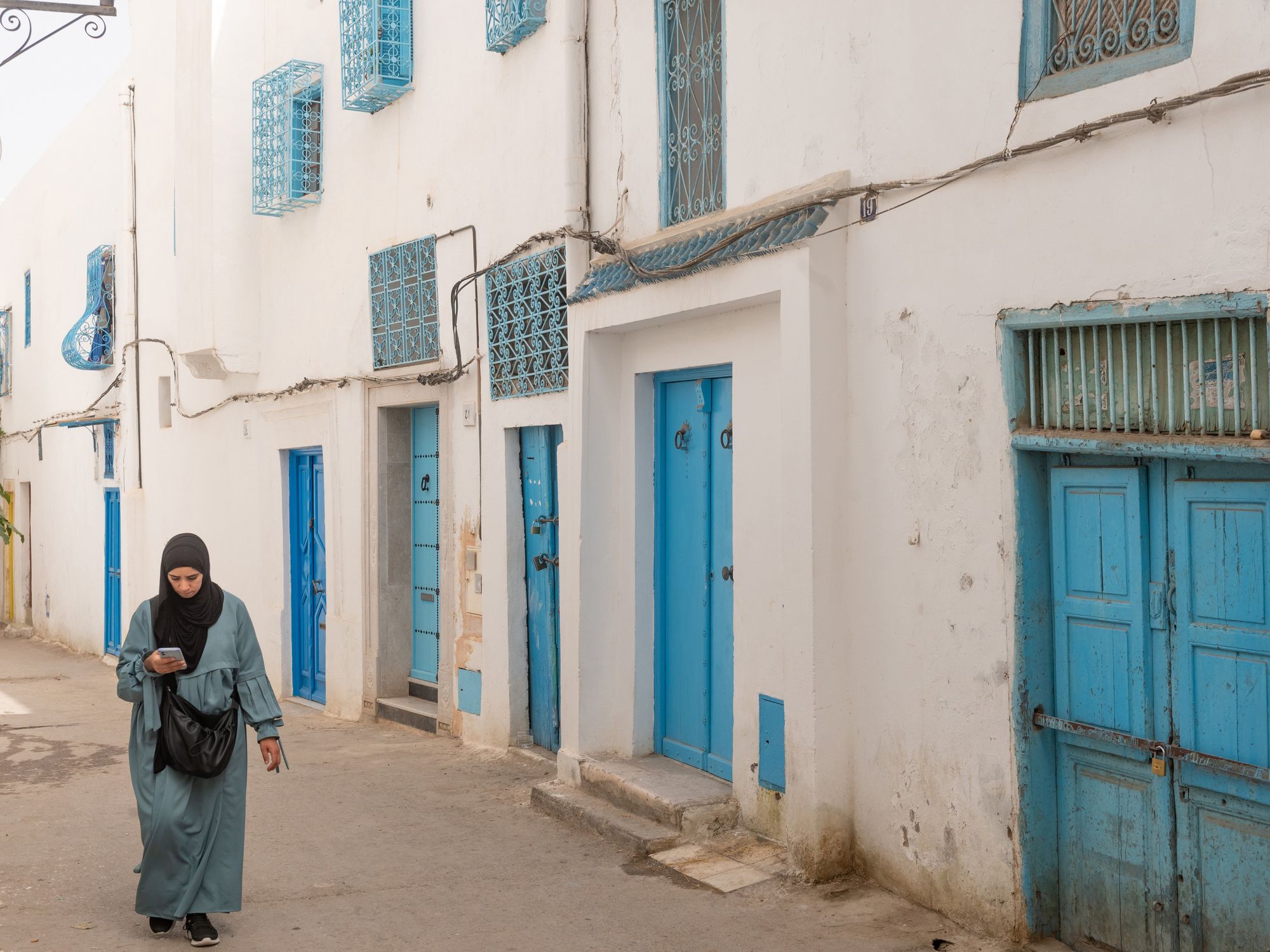 A woman walking down the street in Tunisia