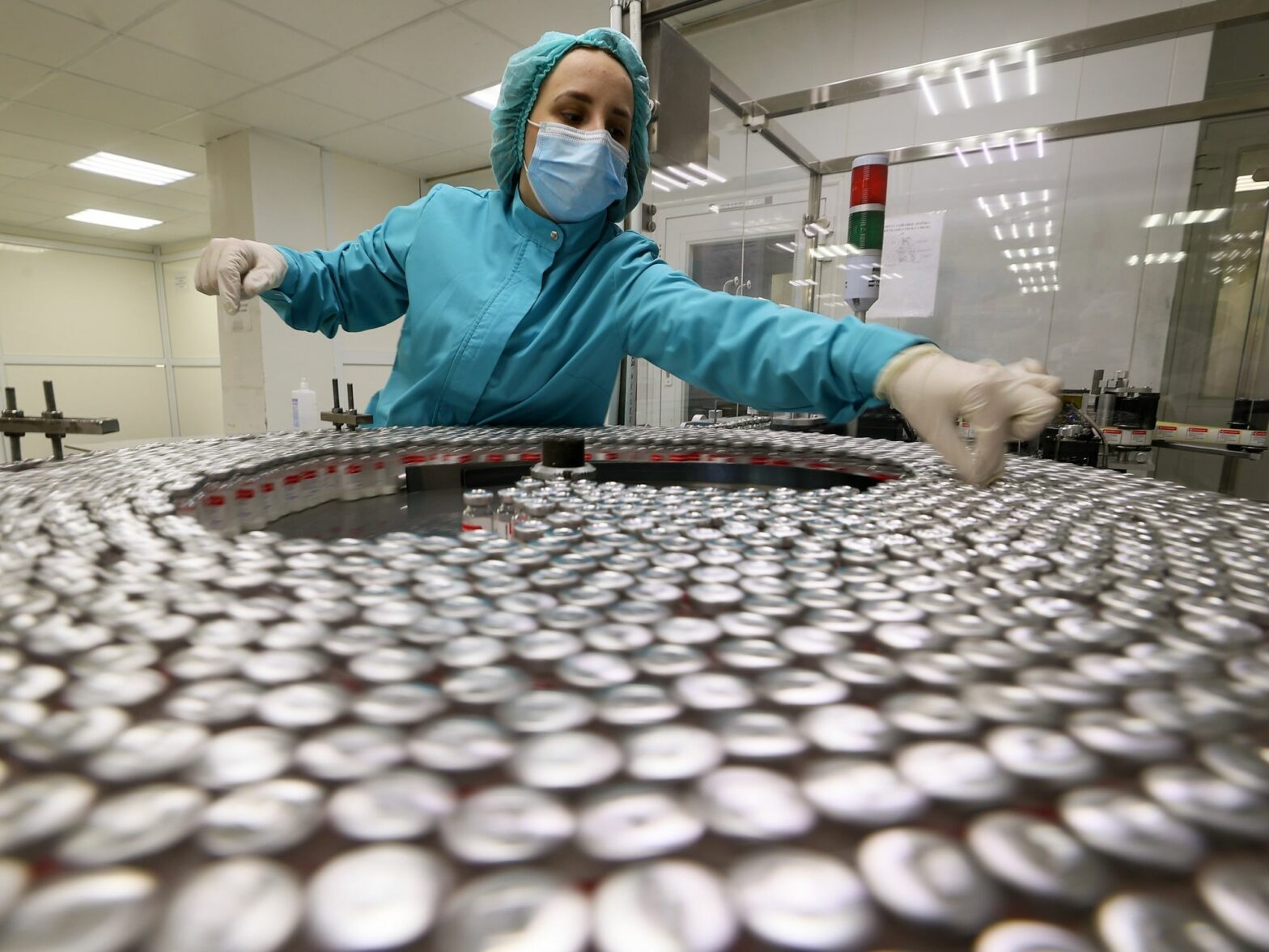 A worker on the production line for injectable antibiotics at the Biokhimik pharmaceutical plant owned by Promomed Group