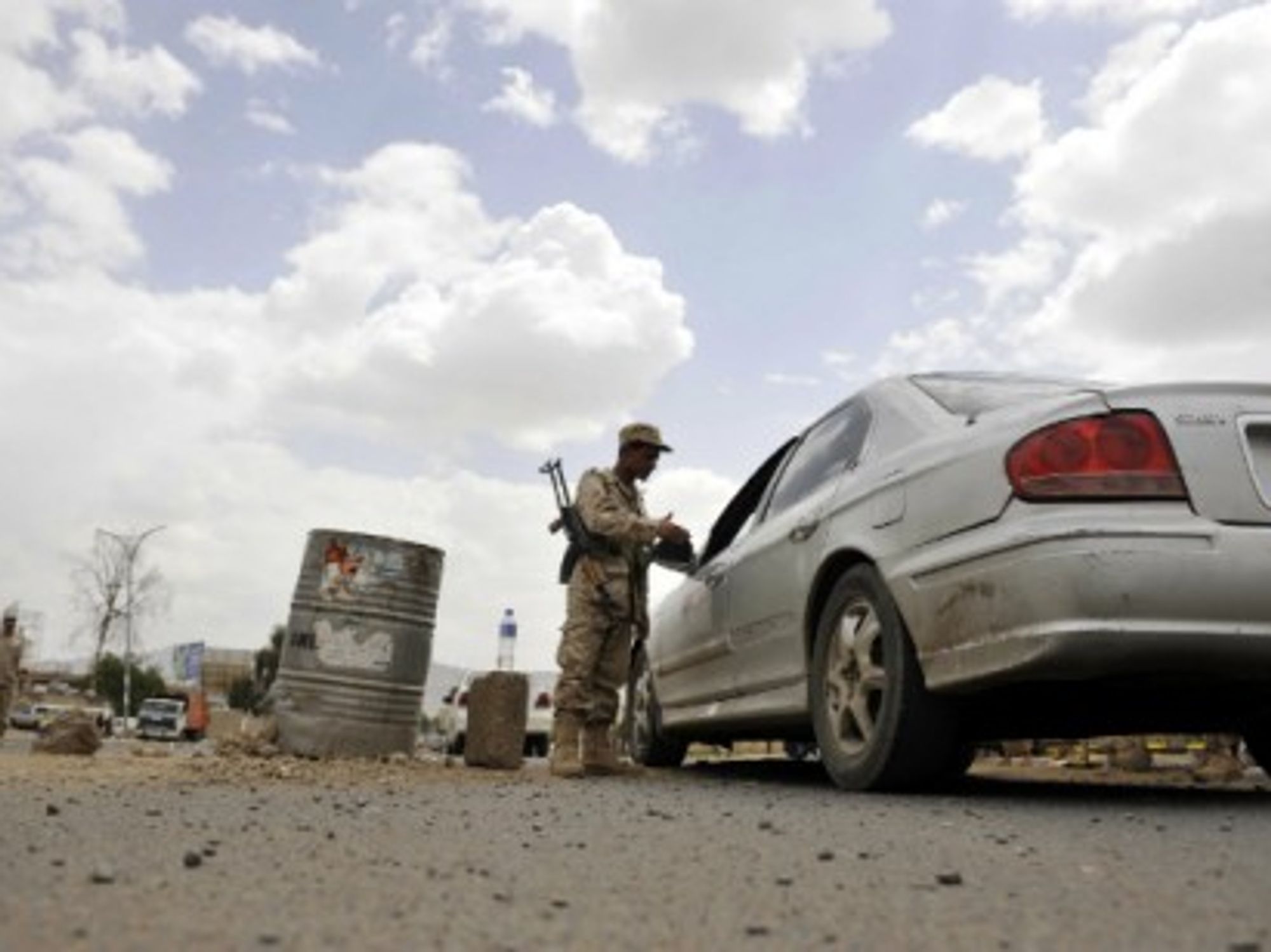 A Yemeni soldier checks a car in Sanaa, Yemen, on May 6, 2014 â€” Mohammed Mohammed/Xinhua/ZUMA