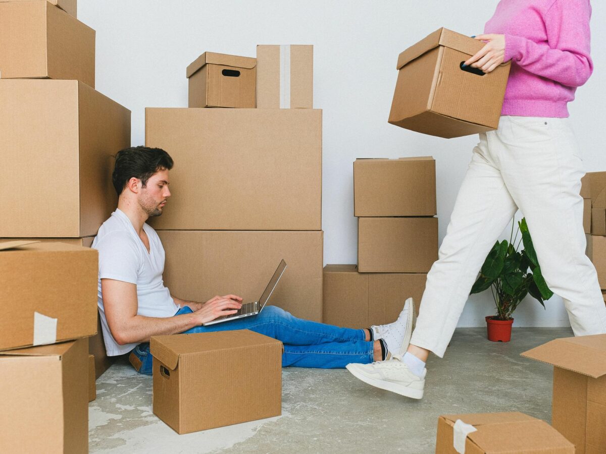 A young couple moving into a home