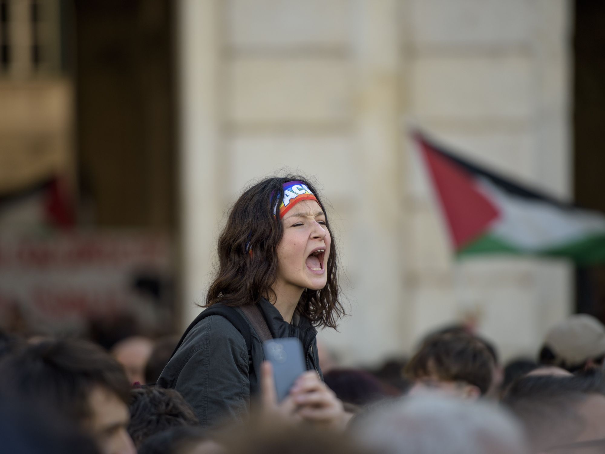 A young girl with a peace hair band shouts phrases of support for Palestine during a demonstration