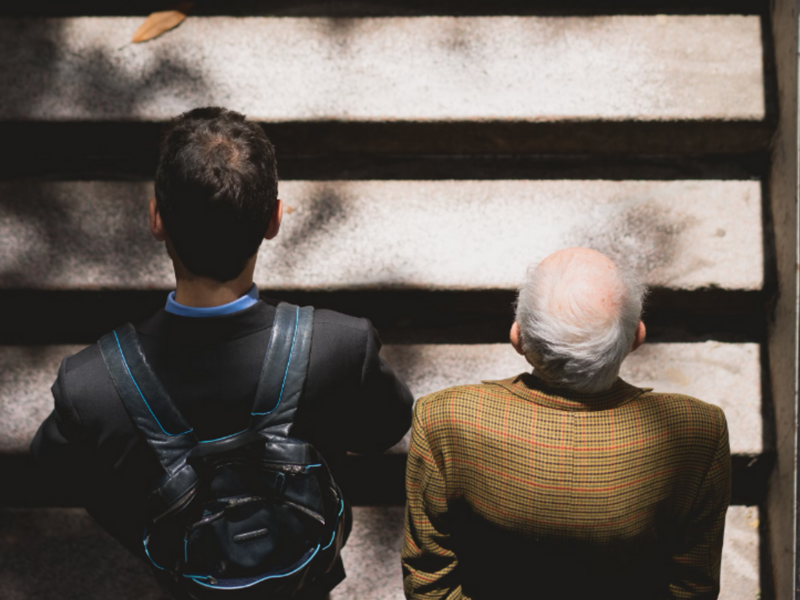 A young man and old man in stairs