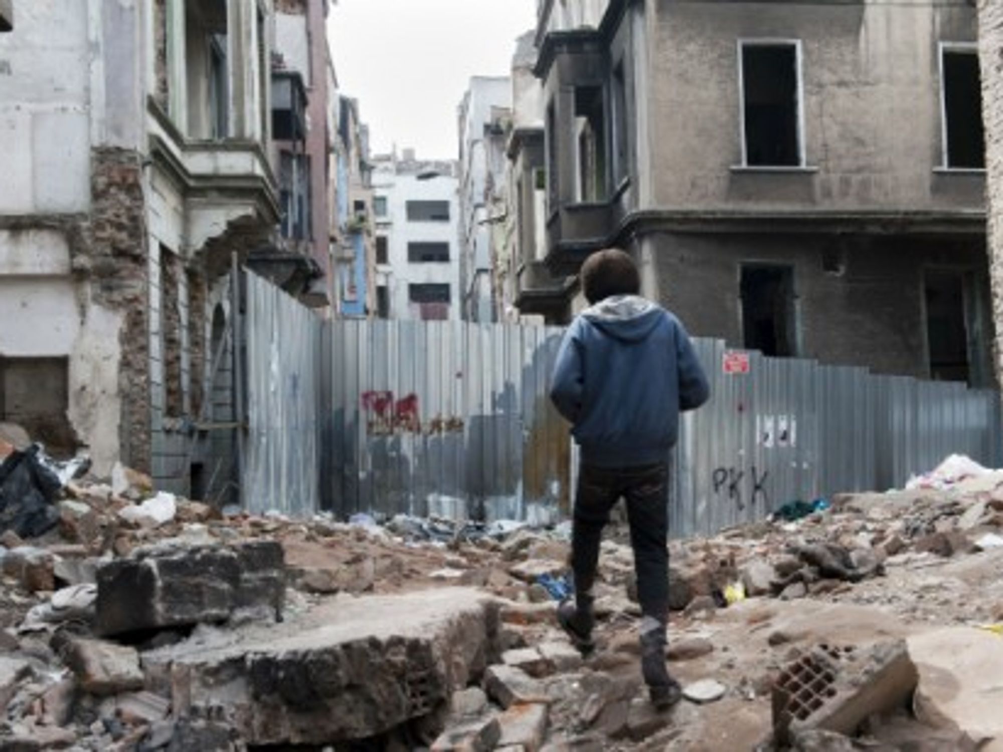 A young Syrian refugee walks in Istanbul's Tarbalasi district