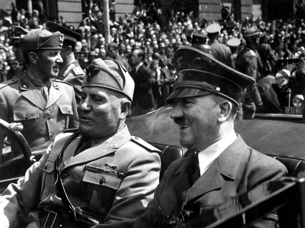 Adolf Hitler and Benito Mussolini are driven through the crowd in Munich in 1940.