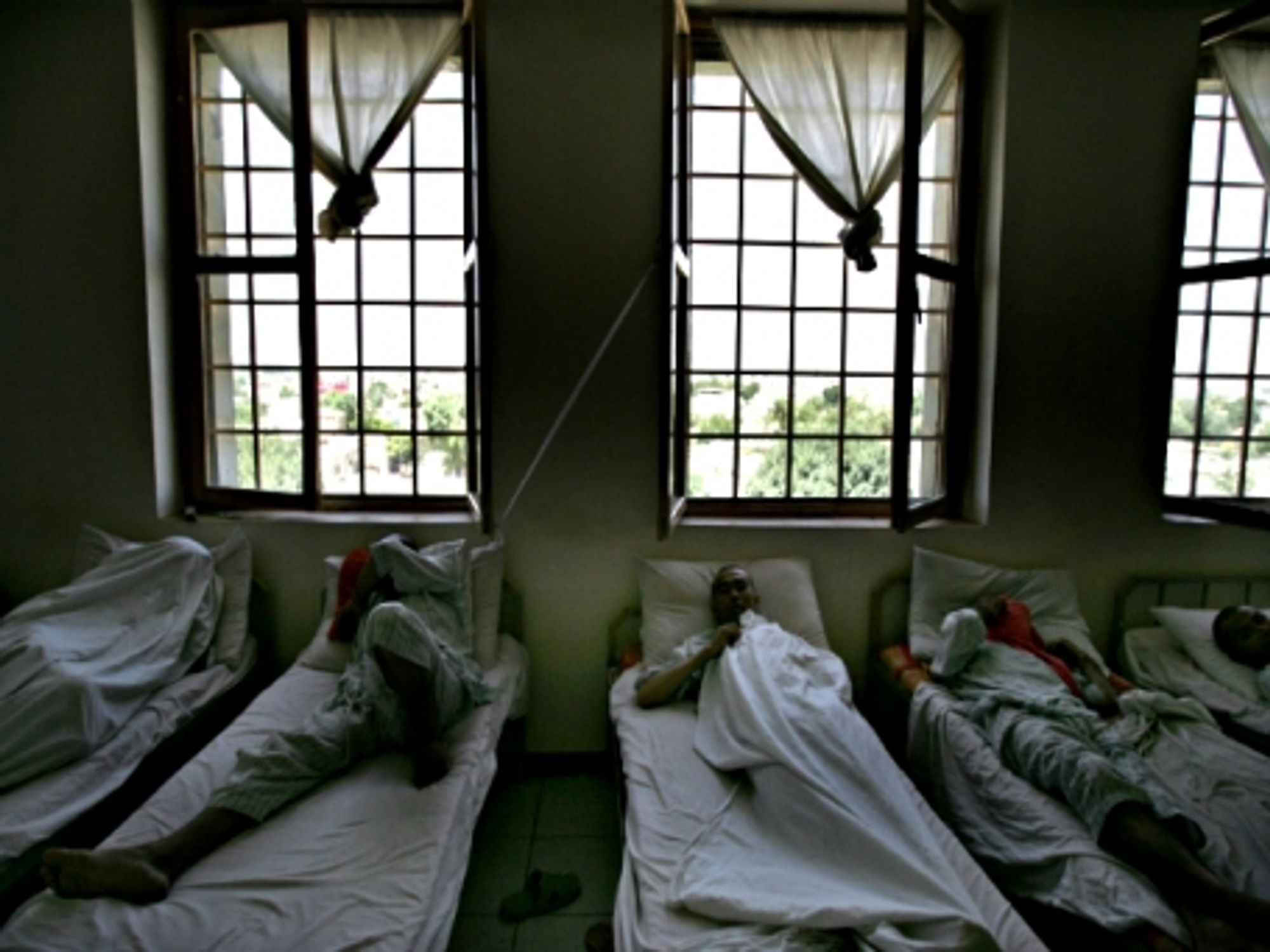 Afghan drug addicts lay on their beds during their treatment at a hospital in the capital in 2012.