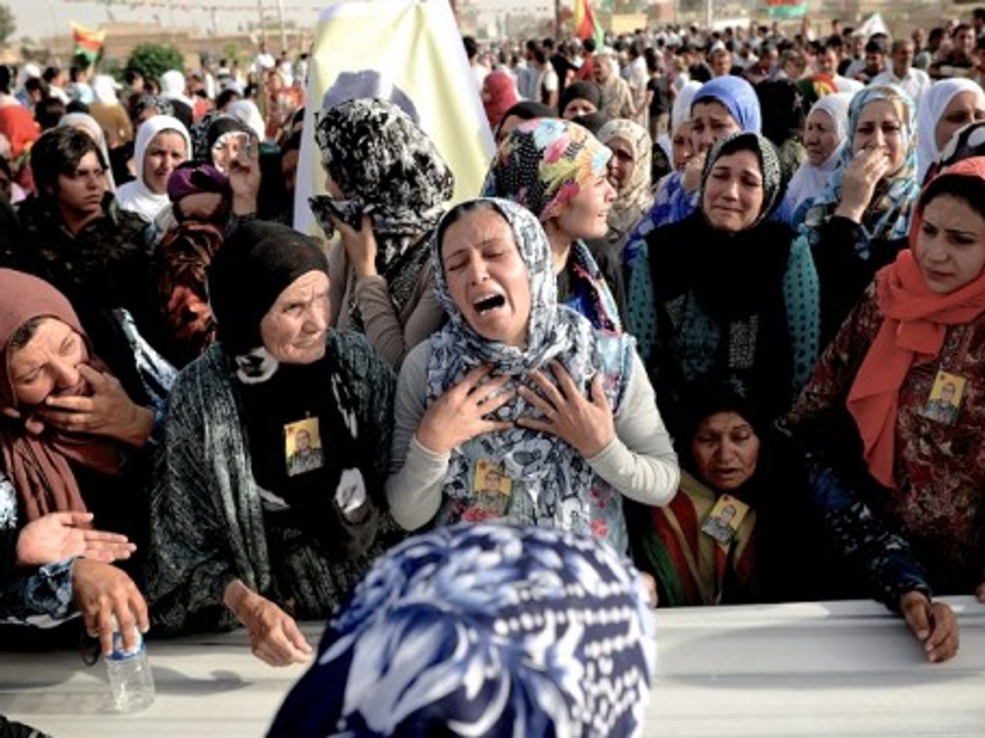 Al-Hasakah, Syria - Women mourn during a funeral of Kurdish fighters killed by ISIS.