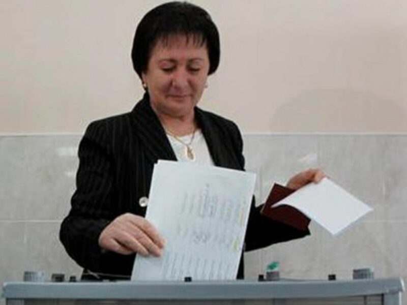 Alla Dzhioyeva casting her ballot during the first round of elections.