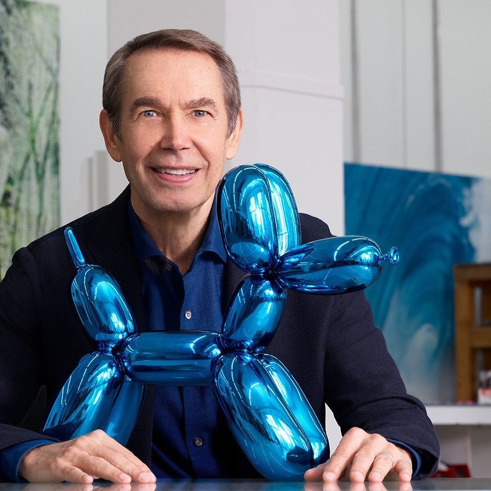 American artist Jeff Koons with one of his famous metallic "Balloon Dogs".