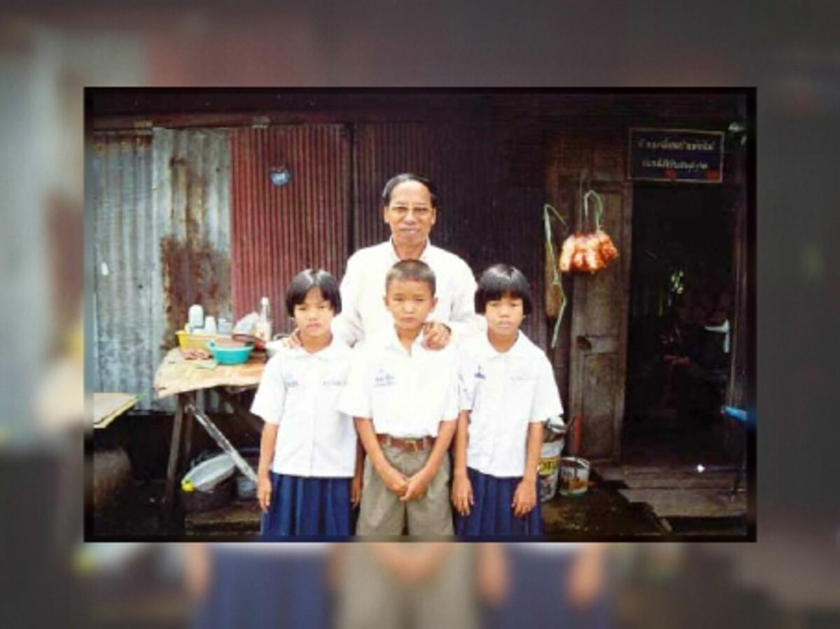 Amporn Wathanavong with some of the children his organization helps