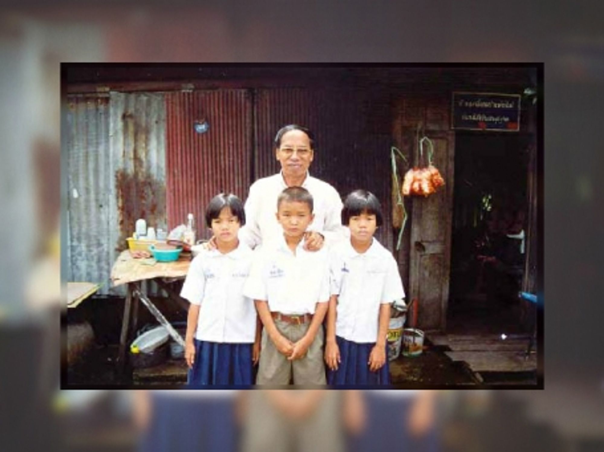 Amporn Wathanavong with some of the children his organization helps