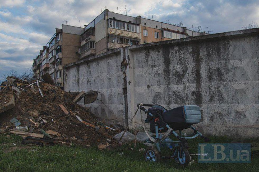 An abandoned stroller among the debris.