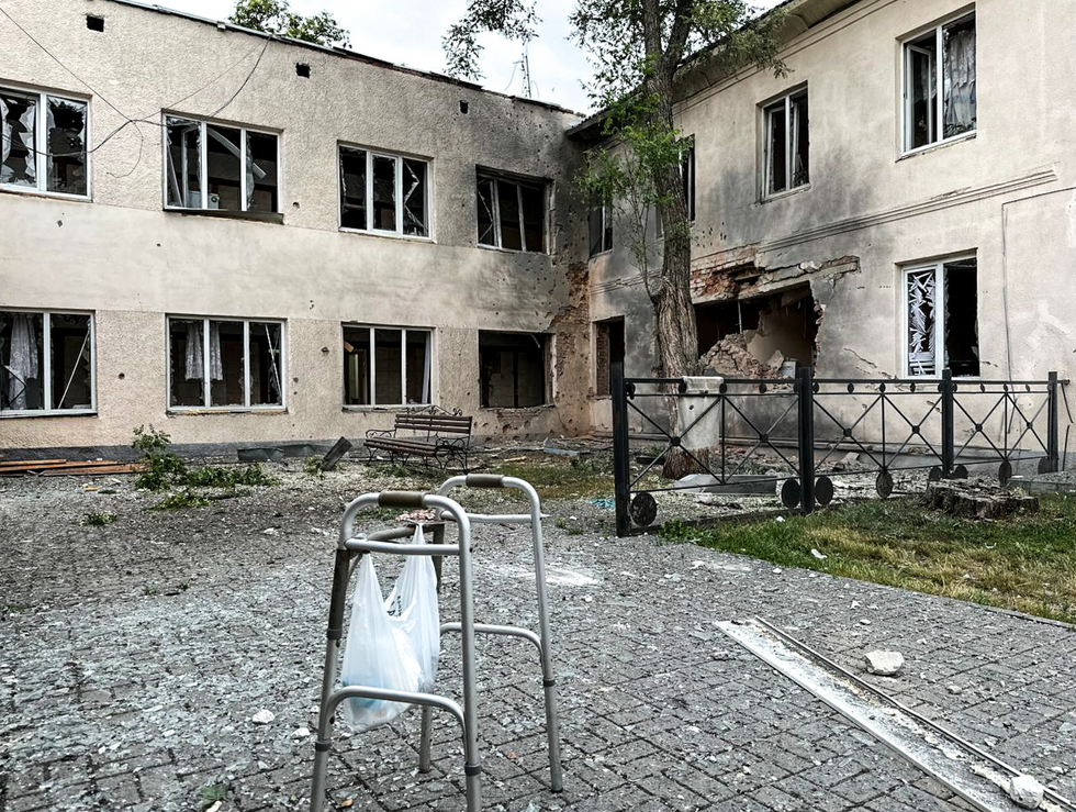 An abandoned walker outside of a building damaged by Russian military strikes in the Belogrod region.
