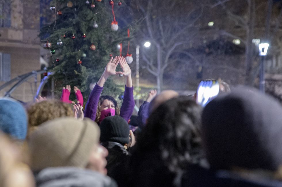 An activist of the feminist movement makes the vagina sign with his hands during the demonstration organized by ''Non Una di Meno'' in Rome.
