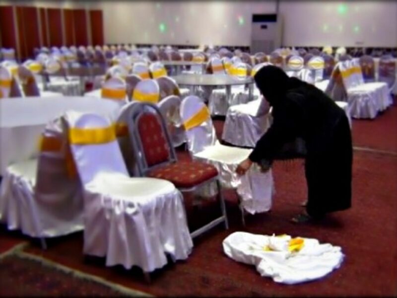 An Afghan woman works as a waitress at a wedding hall in Kabul.