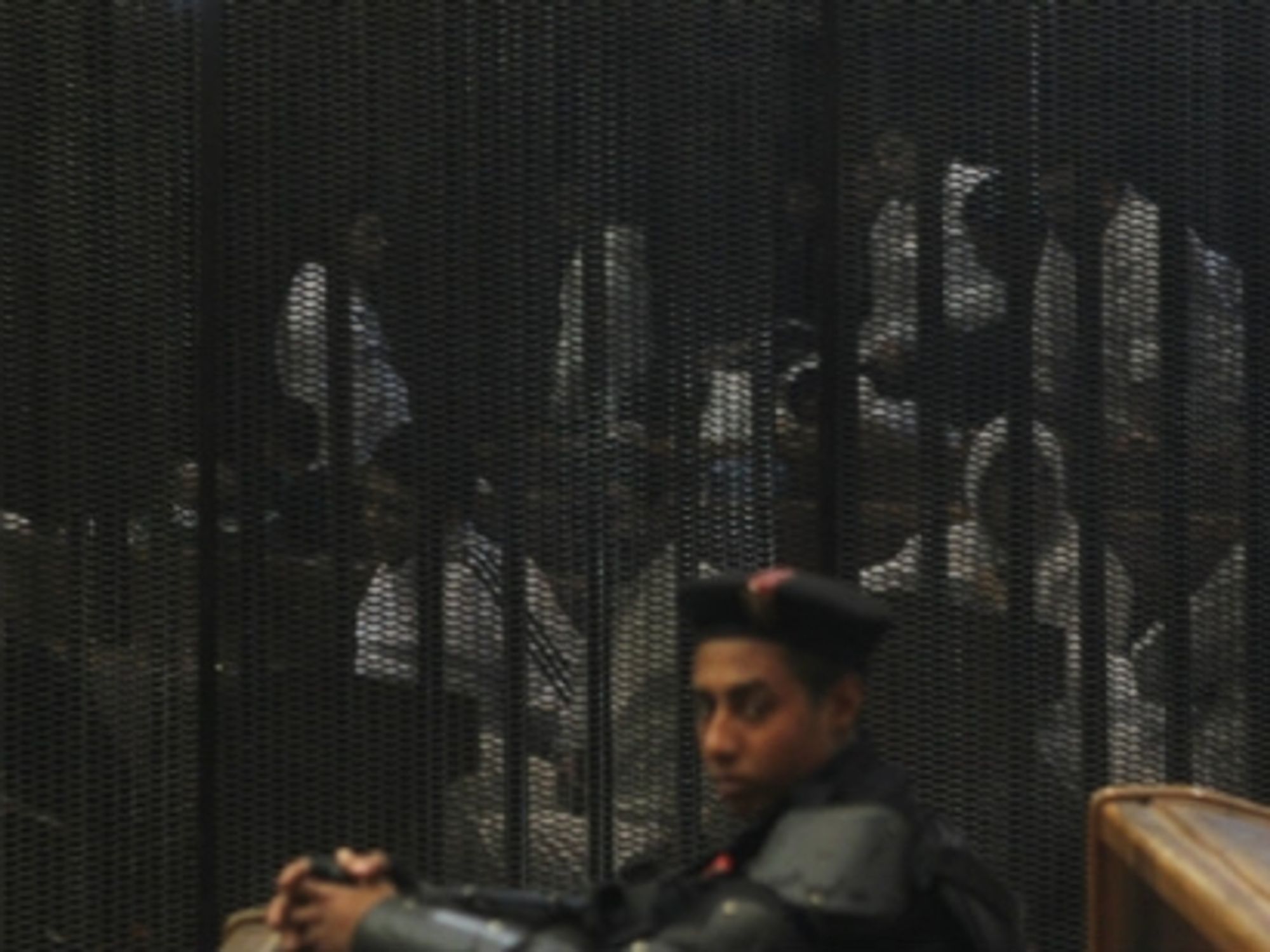 An Egyptian guard at a recent trial in Cairo.
