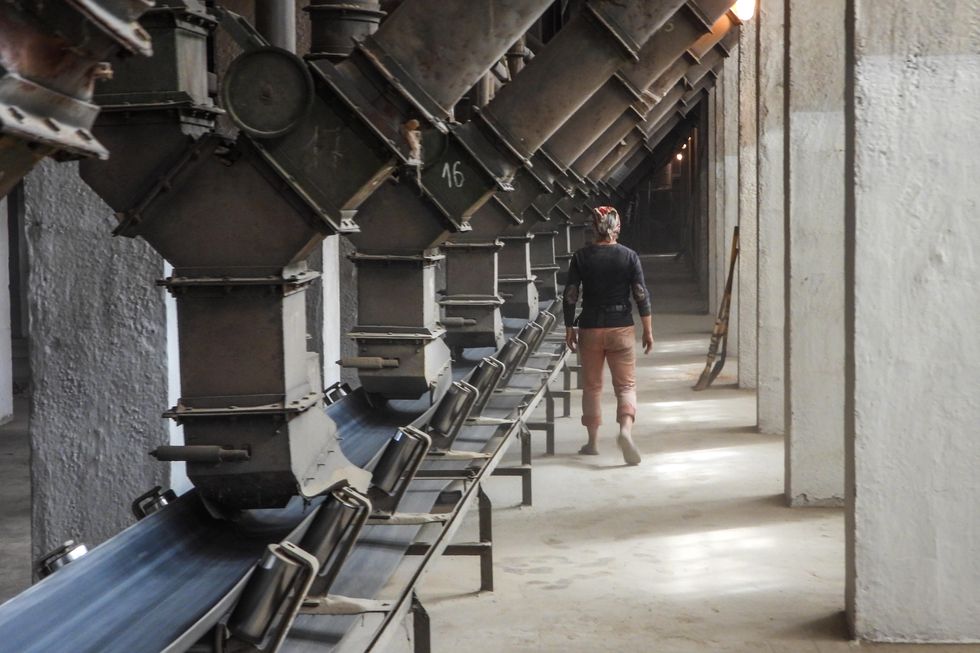 An employee is seen at the Melitopol Elevator grain storage.