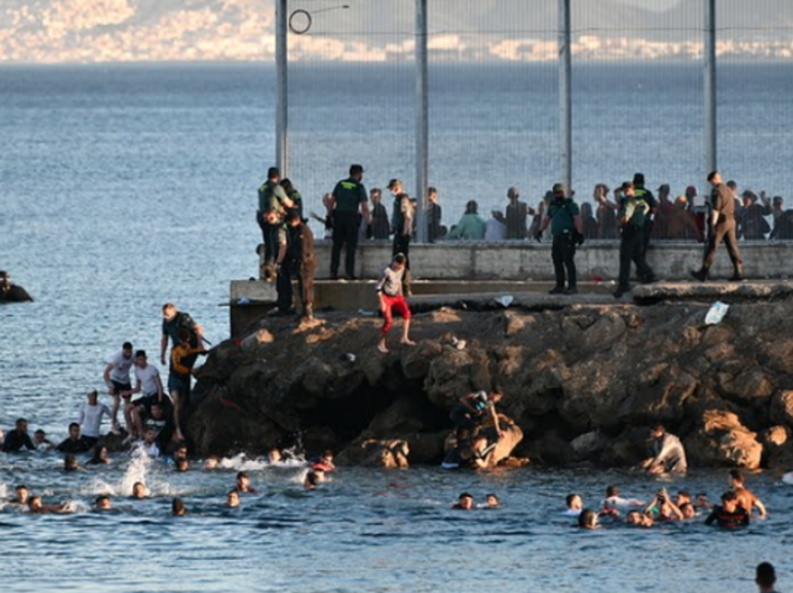 An estimated 6,000 Moroccan migrants have reached Spain's Ceuta enclave