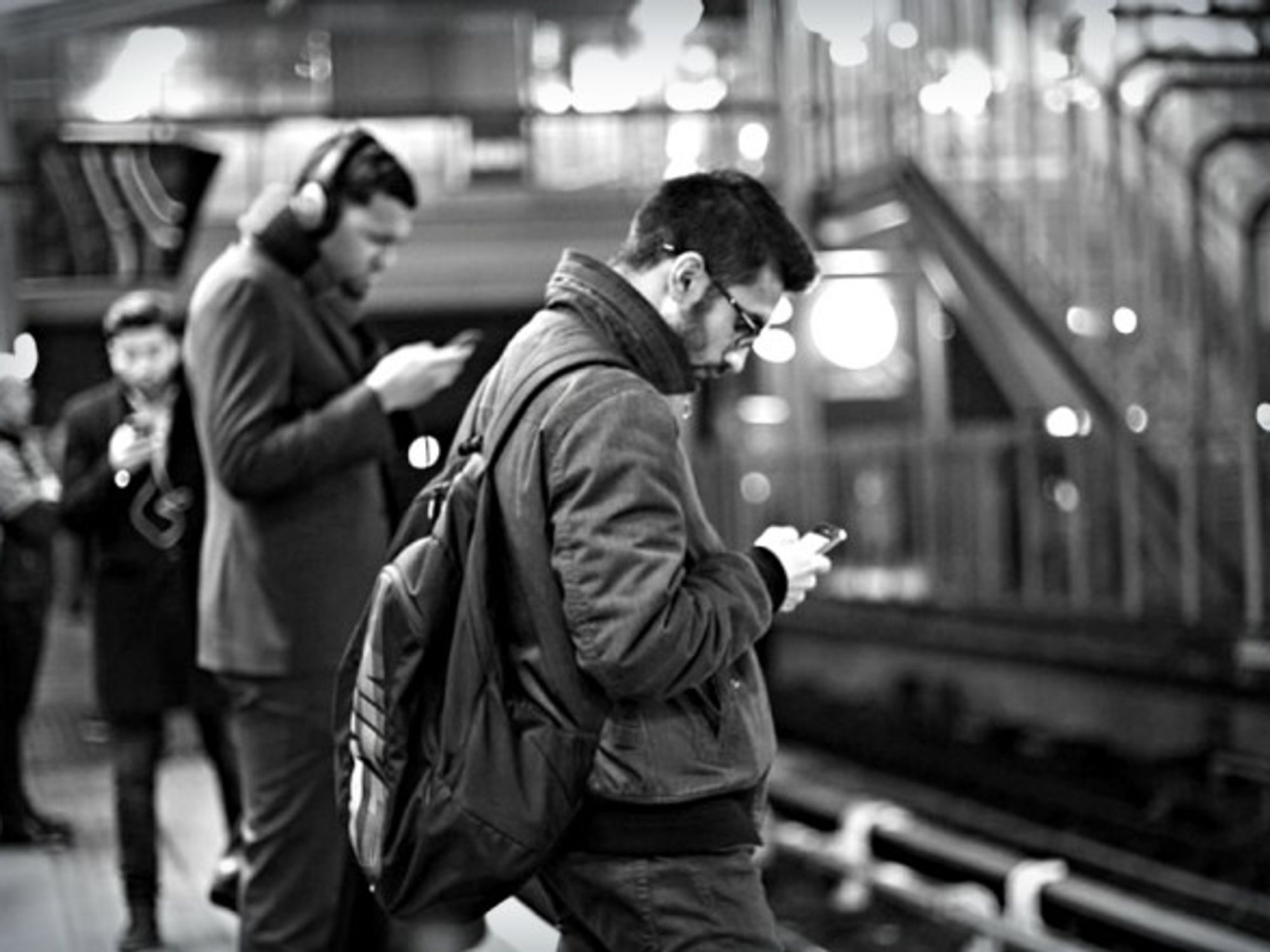 An idle moment waiting for the train resolved with phones