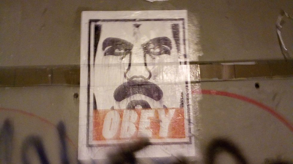 An illustrated poster of Nicolás Maduro with the word "OBEY" in bold letters underneath his face