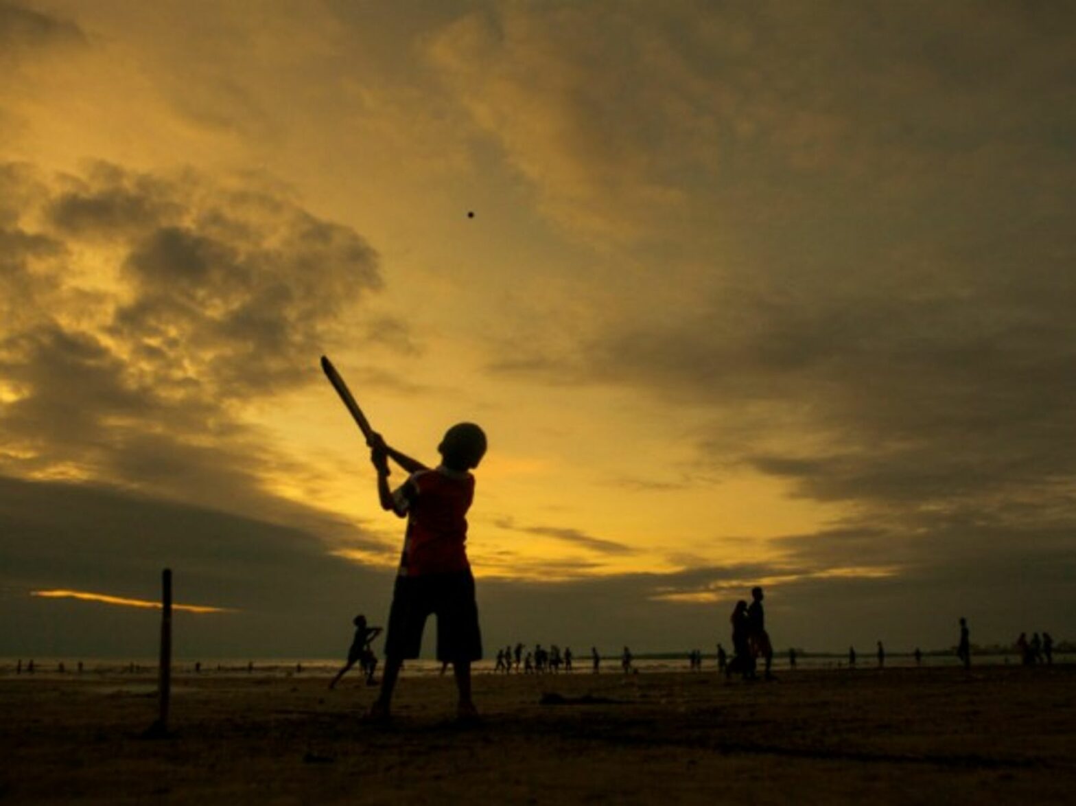 An Indian boy playing cricket.