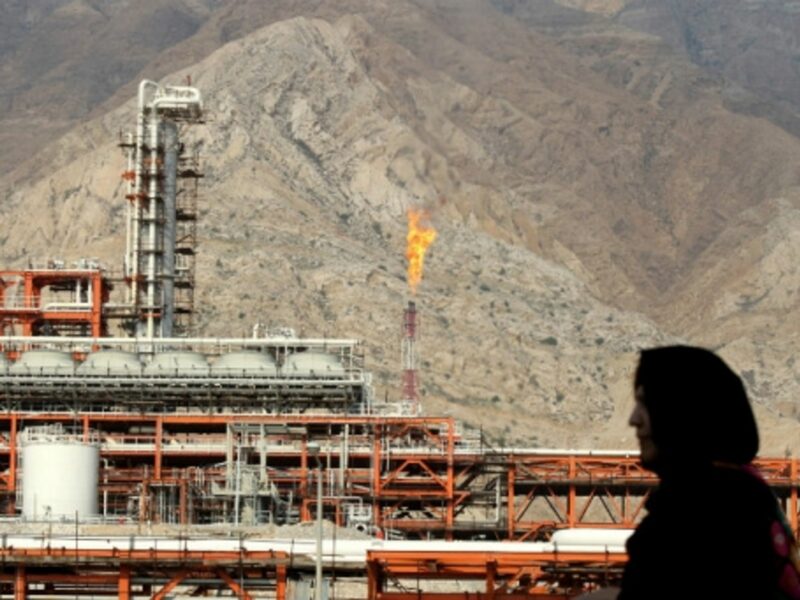 An Iranian woman walks at the South Pars gas field.