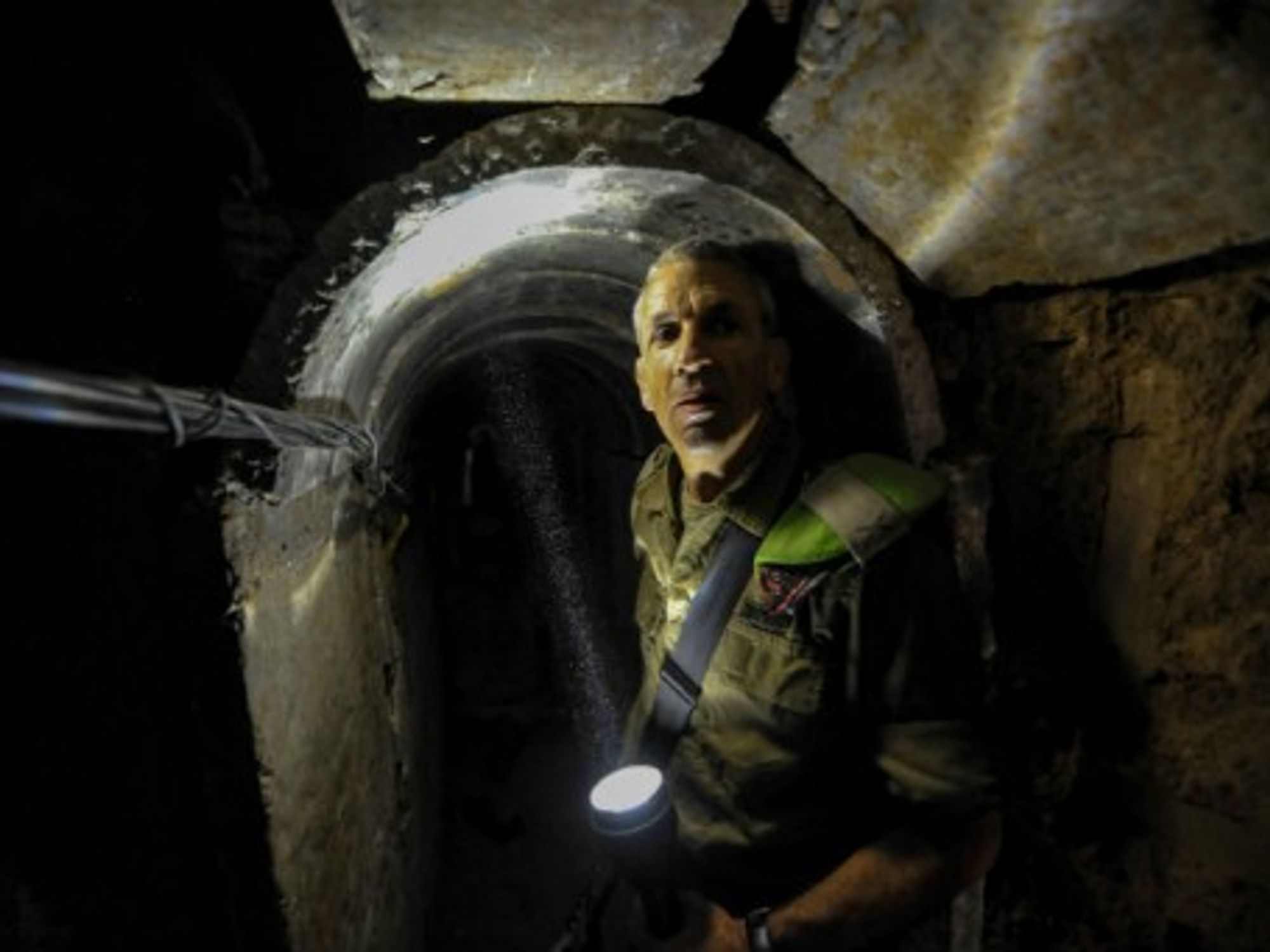 An Israeli officer shows the inside of a tunnel discovered last year near Kibbutz Ein Hashlosha