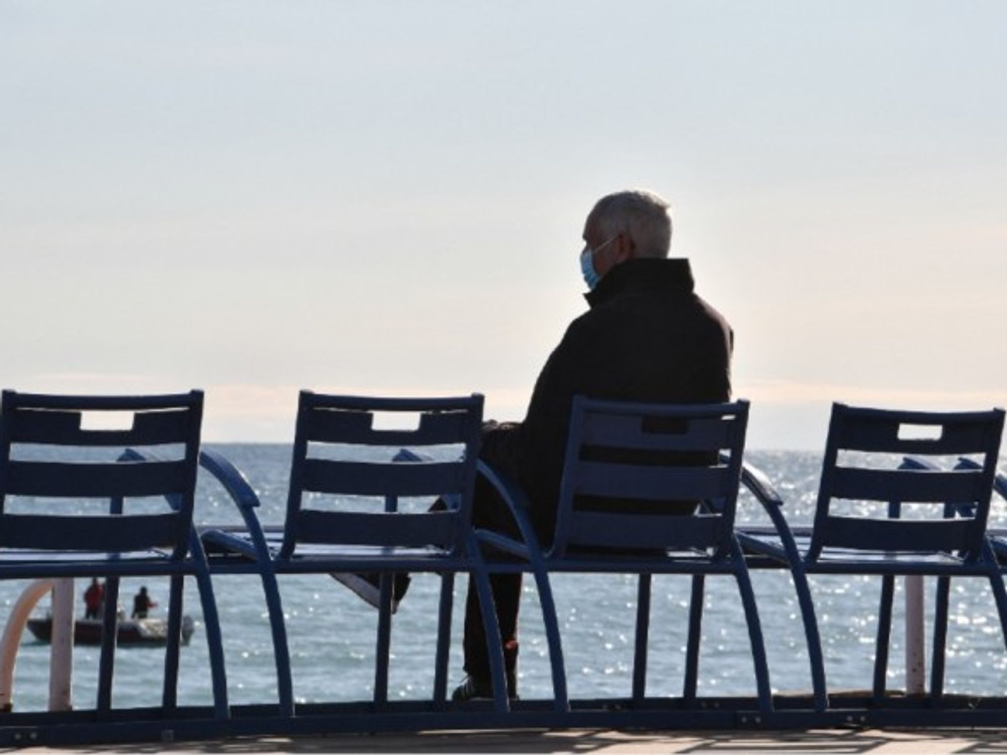 An old man enjoying the sun in Nice, in February 2021.