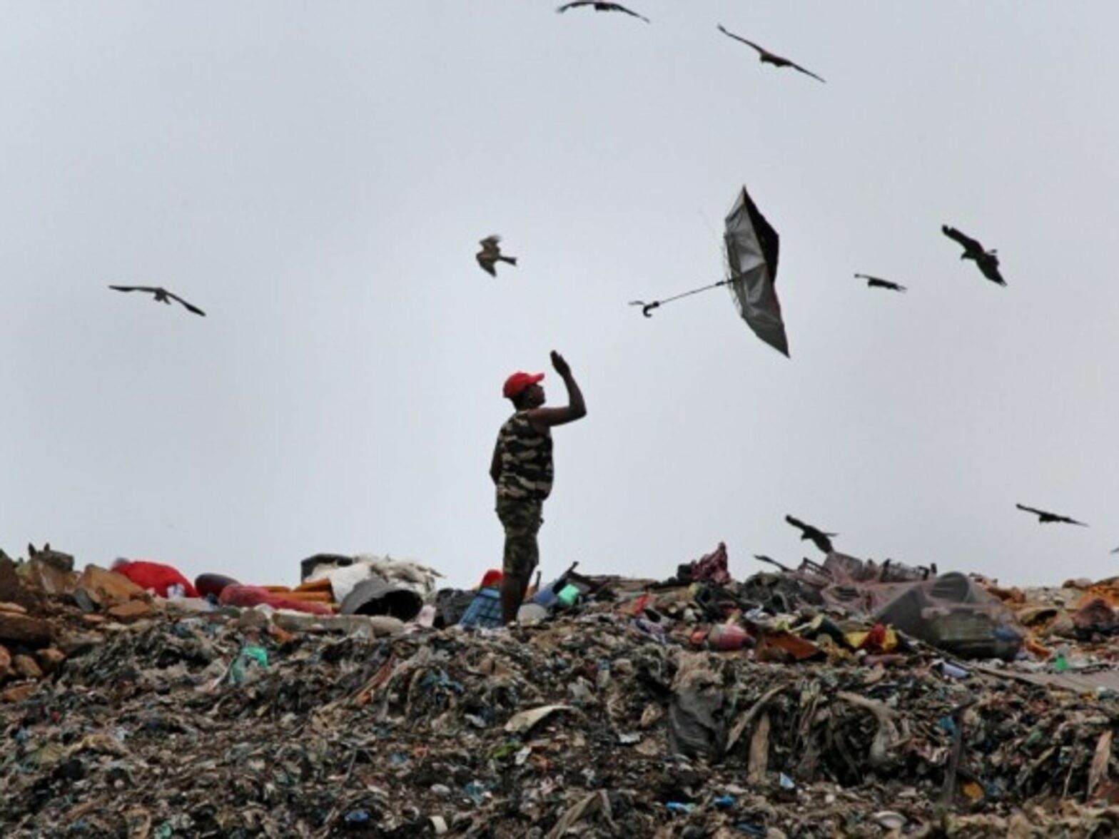 An umbrella flies out of a man's hand in Mumbai, India.