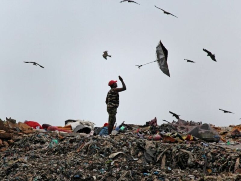 An umbrella flies out of a man's hand in Mumbai, India.