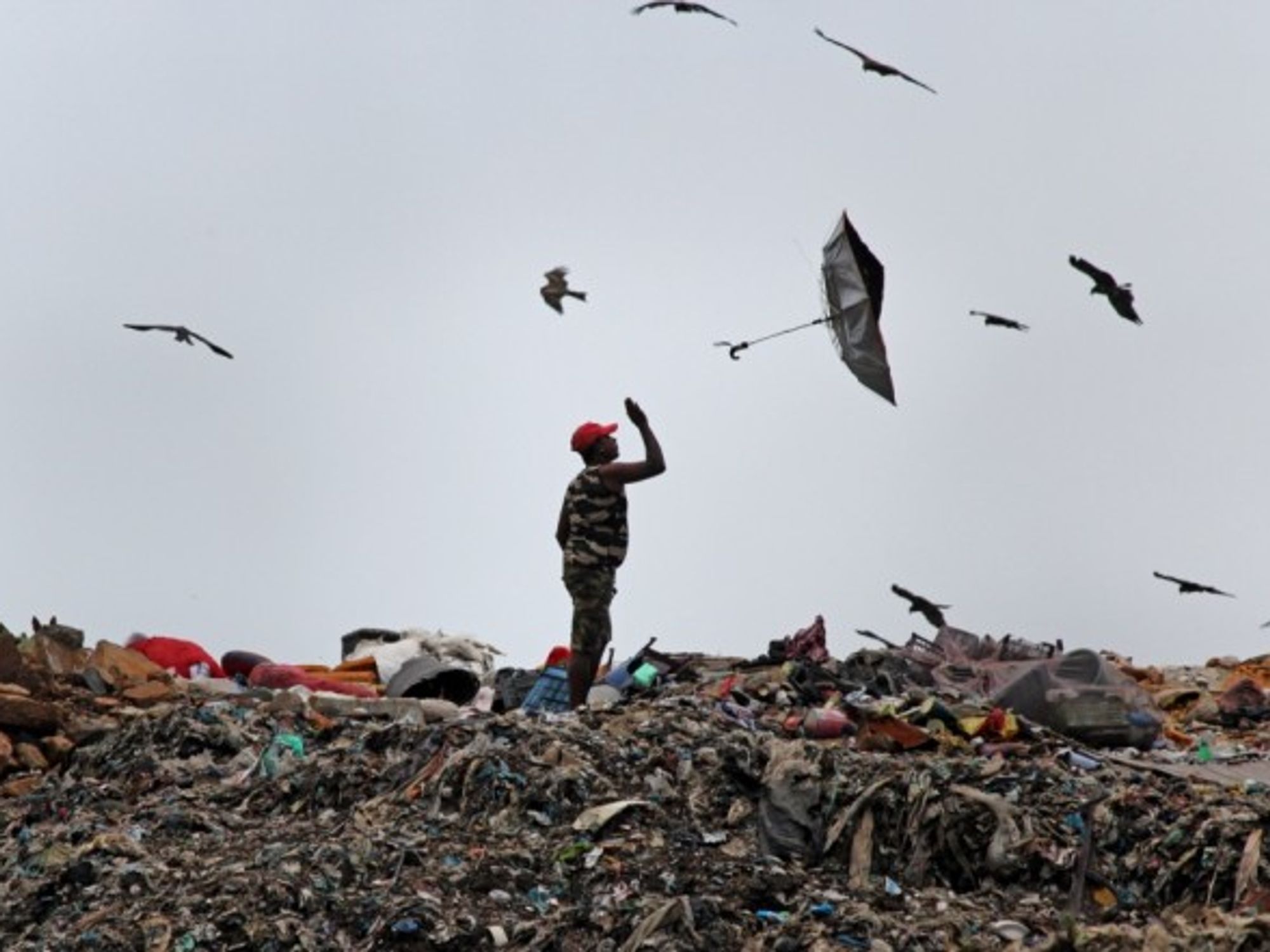An umbrella flies out of a man's hand in Mumbai, India.