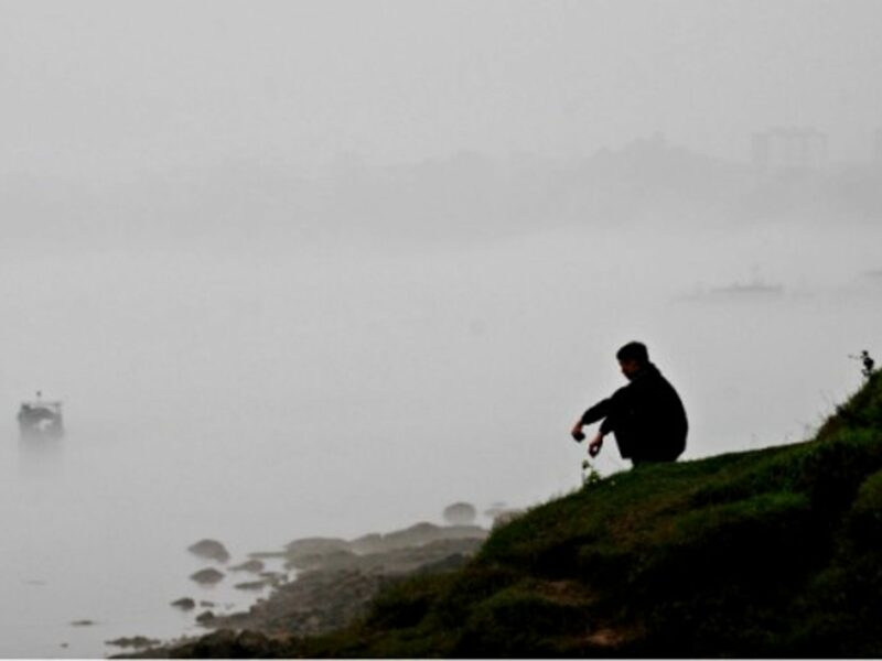 An unidentified man on the banks of the Yellow River