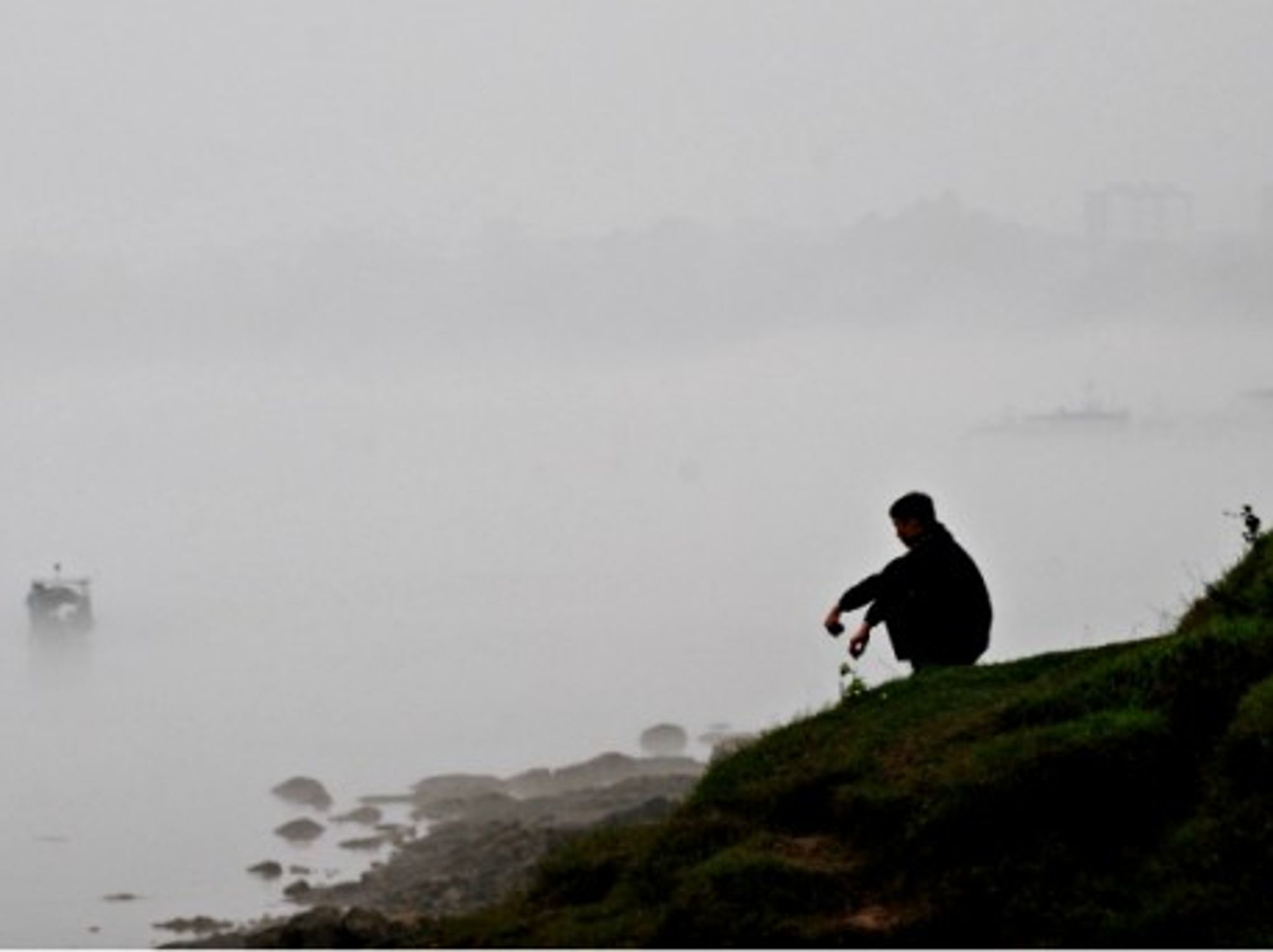 An unidentified man on the banks of the Yellow River