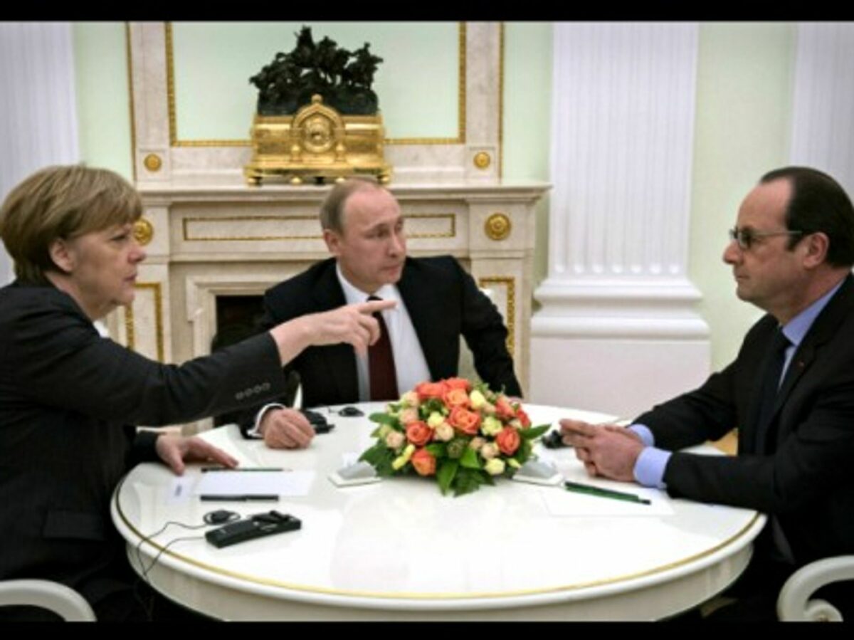 Angela Merkel, Vladimir Putin and Francois Hollande in Moscow on Feb. 6.
