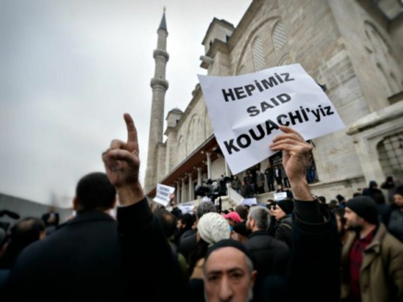 Anti-Charlie Hebdo protester carrying a sign reading "We are all Said Kouachi" in Instanbul on Jan. 16