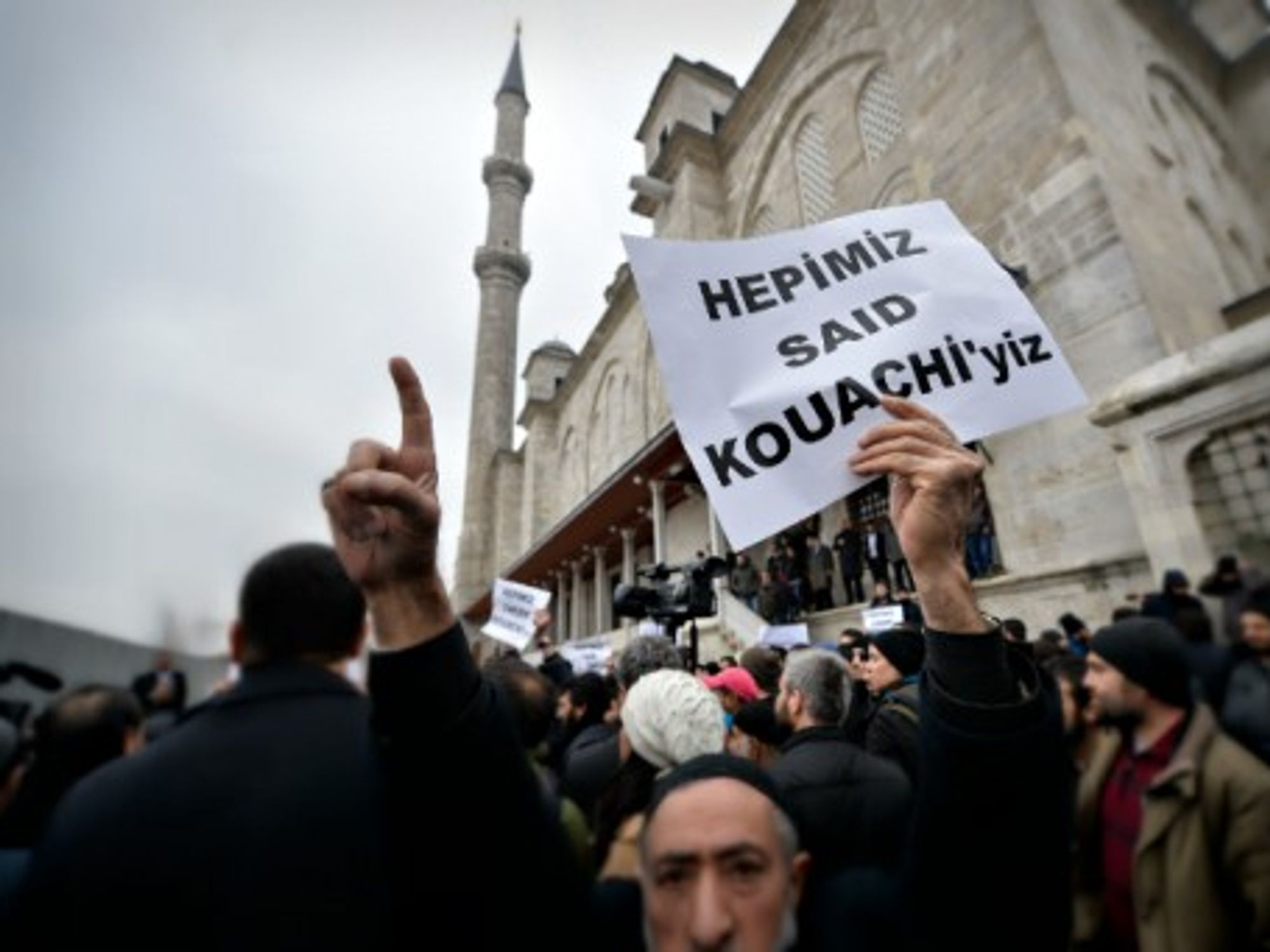 Anti-Charlie Hebdo protester carrying a sign reading "We are all Said Kouachi" in Instanbul on Jan. 16
