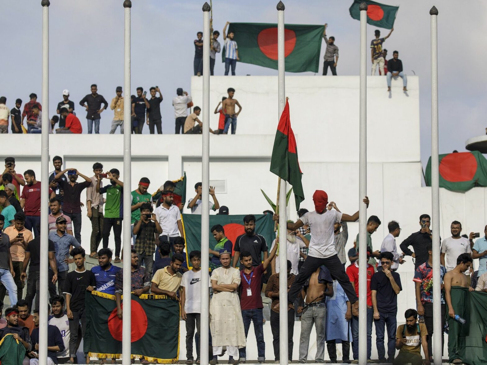 Anti-government demonstrators storm Prime Minister Sheikh Hasina's palace in Dhaka after her 15-year rule ended, Dhaka, Bangladesh, Aug. 5, 2024.