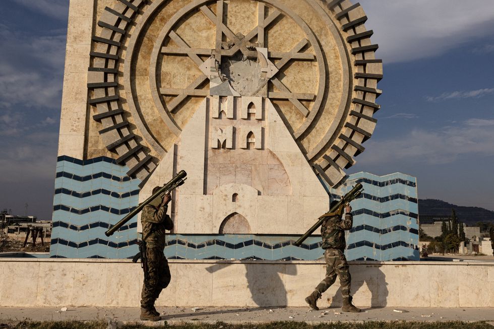 Anti government forces patrol the Syrian city of Salamiyah in the central Hama governorate, Hama, Syria, Dec. 6, 2024.