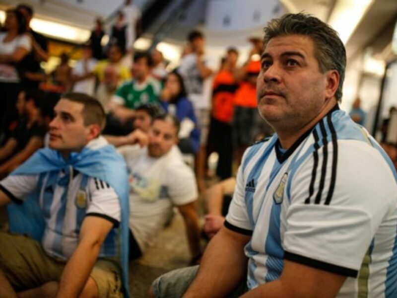 Argentina's fans react while watching the final match of the 2014 World Cup between Germany and Argentina in Brasilia, Brazil, on July 13, 2014.