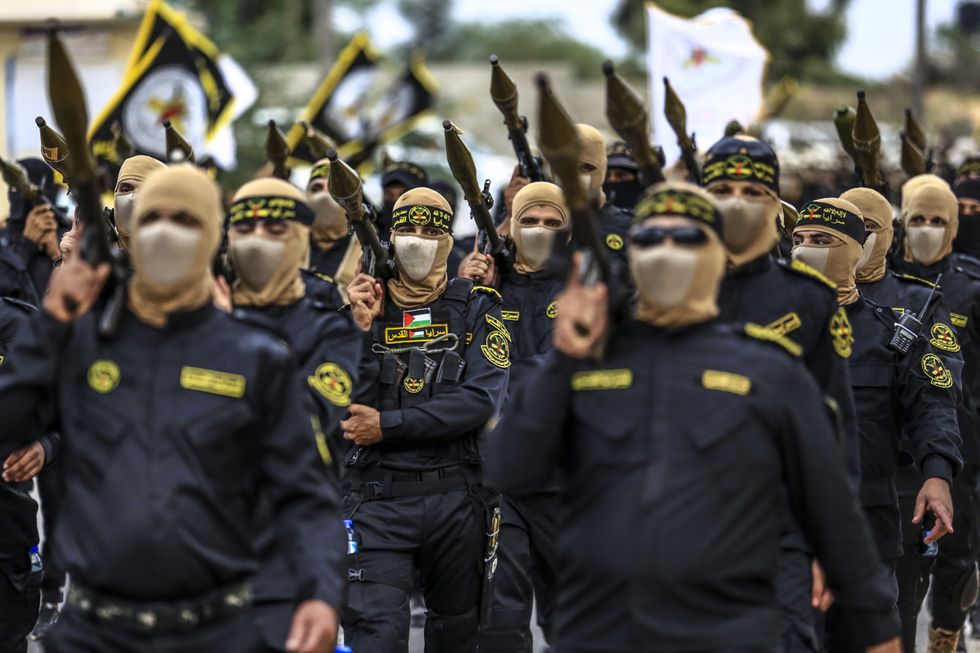 Armed fighters of the Al-Quds Brigades, the armed wing of the Palestinian Islamic Jihad (PIJ) movement join a parade to mark the 36th anniversary of the movement's foundation in the southern of Gaza Strip in October 2023