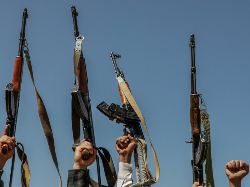 Armed rebels of the Iran-backed Houthi militia take part in a demonstration against the USA and Israel.