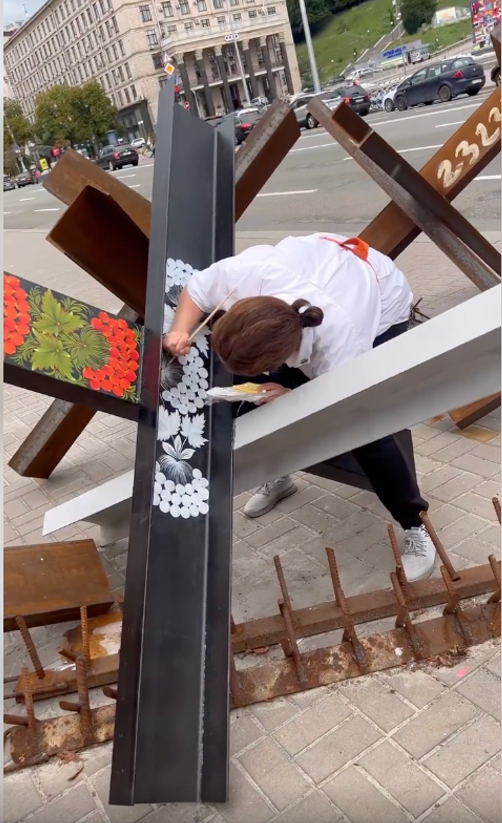 Artist Varvara Logvin painting over Kyiv's anti-tank hedgehogs
